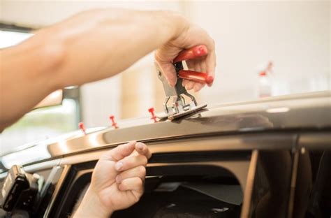 repairing a dent on car.